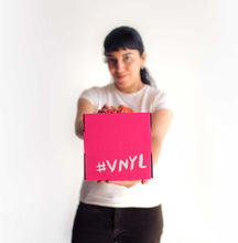 Girl holding VNYL gift membership box